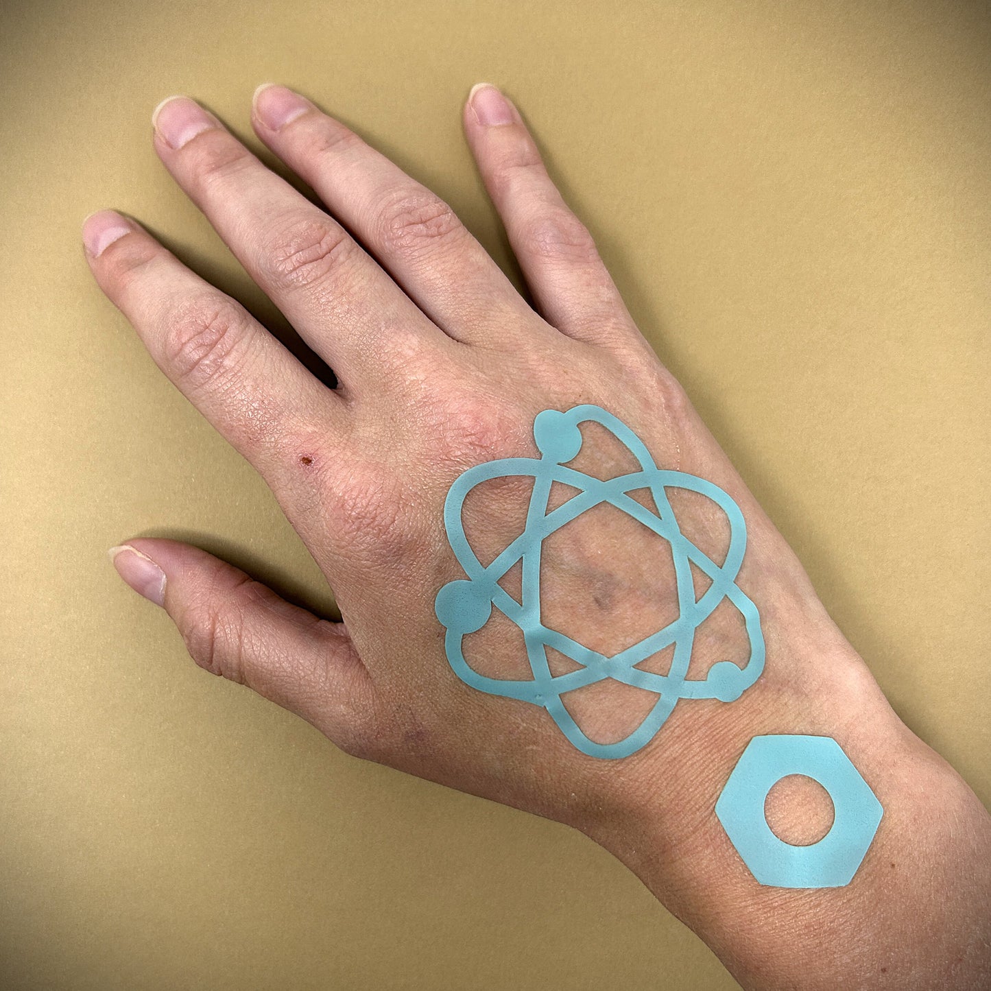 Tanning Sticker Atom Cutout